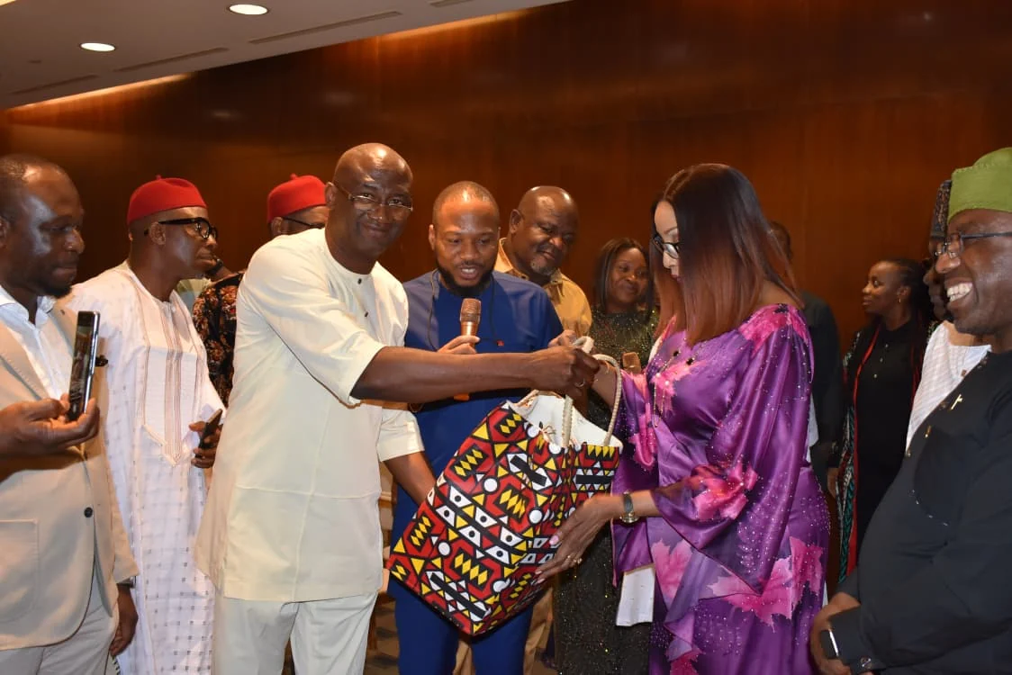 Community leaders exchanging a patterned cultural gift