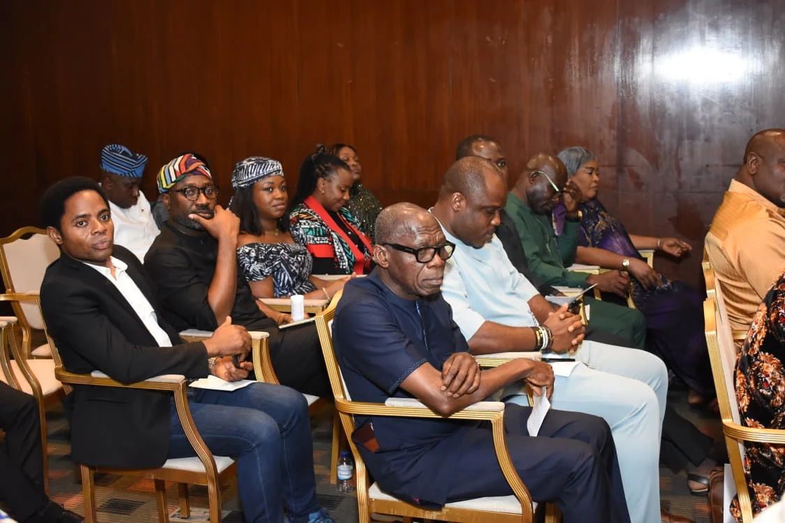 Rows of community members listening during the gathering