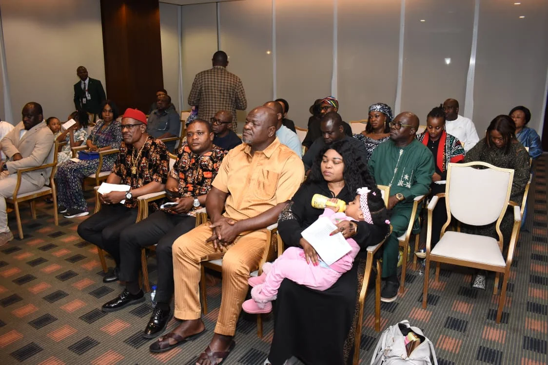 Families and community members seated in the meeting room